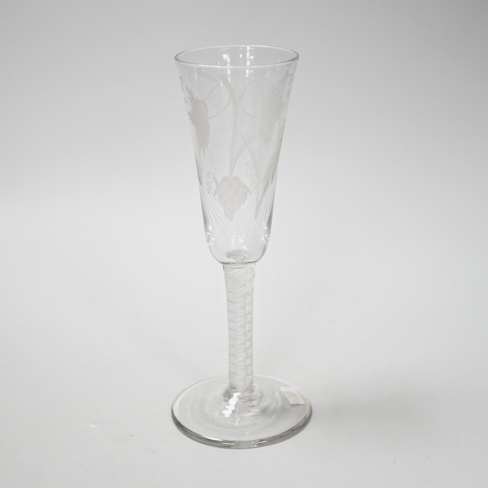 An English lead crystal DSOT ale glass, c.1760, elongated round funnel bowl finely engraved with hops and barley, DSOT stem, pair heavy tapes outside plain gauze, conical foot, snapped pontil, 18.8cm high